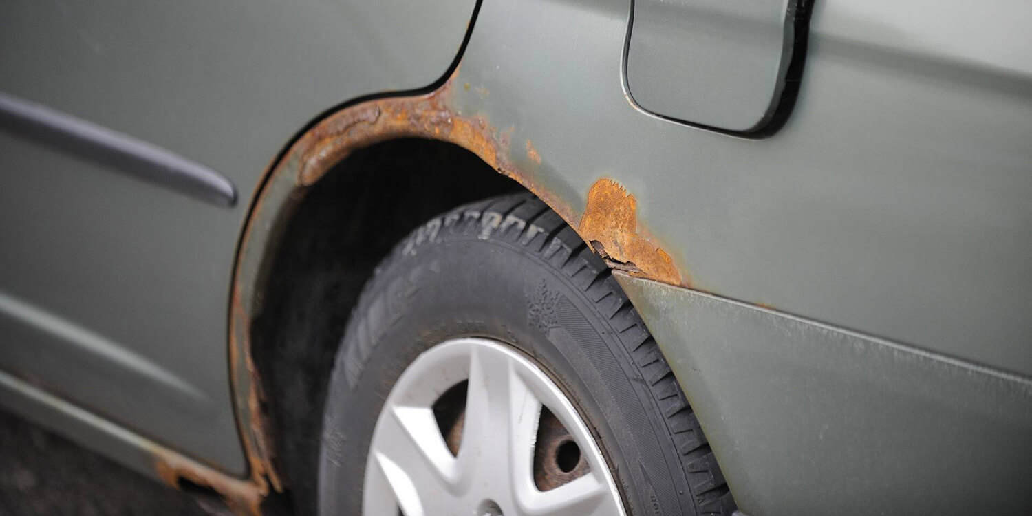 Visible corrosion around a vehicle wheel arch