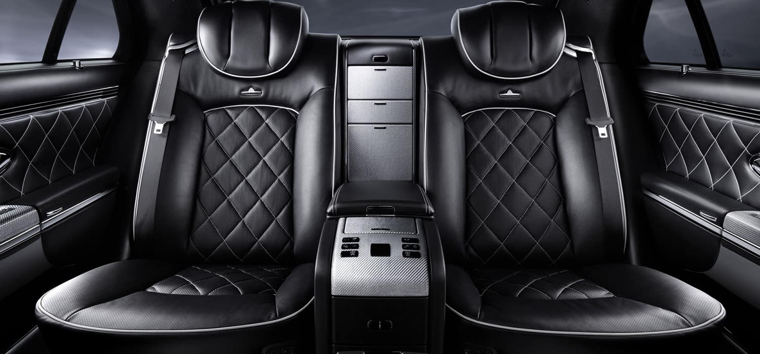 Car seat and cabin upholstery viewed through the front door
