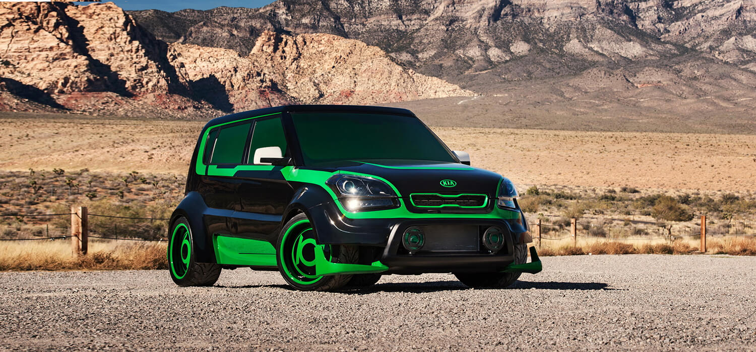 Modified green Kia Soul with contrasting dark body details