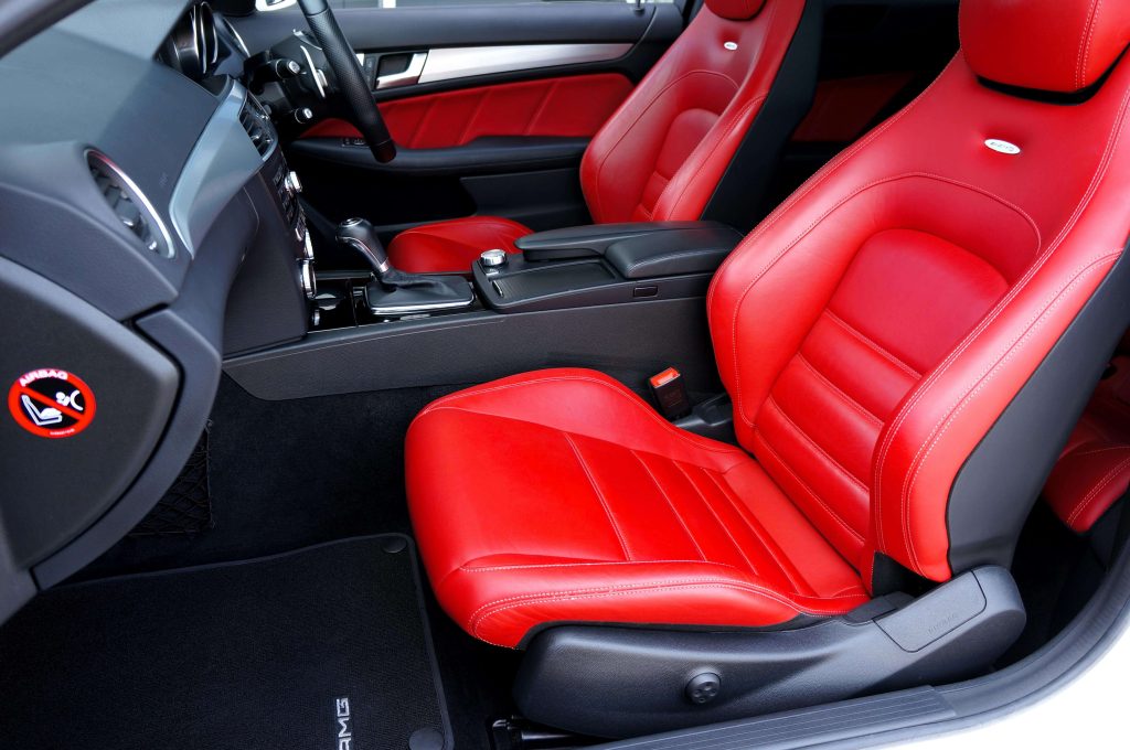 Red leather seats and trim inside a vehicle
