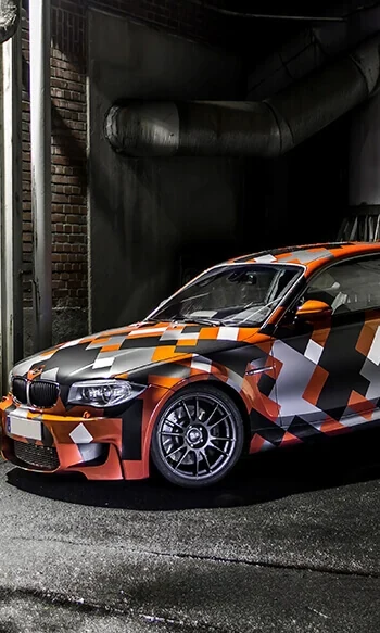 BMW with geometric black, orange and white vinyl graphics
