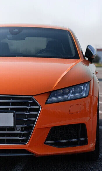 Orange wrapped Audi TT, front end close up