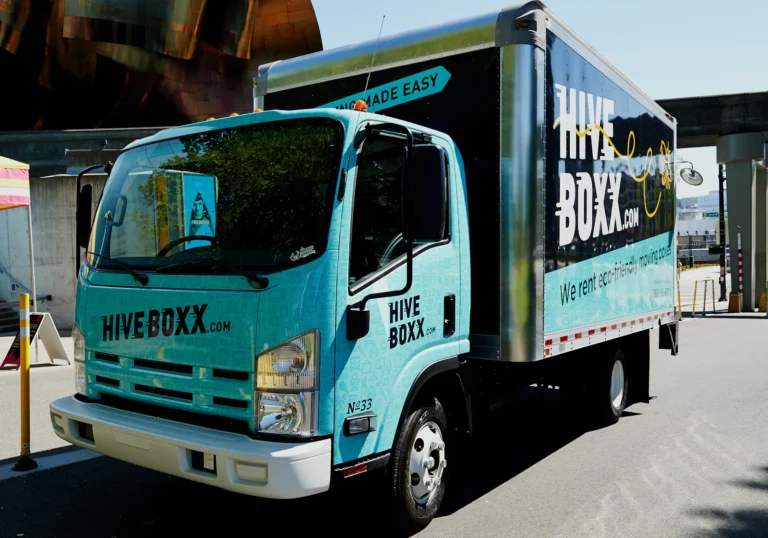 Commercial truck with large side graphics and business name