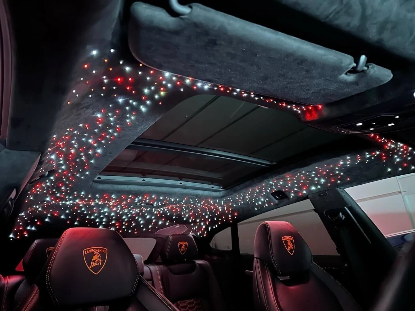 Car headliner design reference with small illuminated points creating a star effect