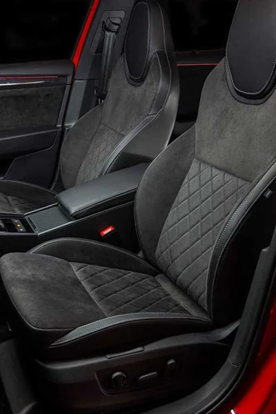 Textured seat upholstery with visible panel construction